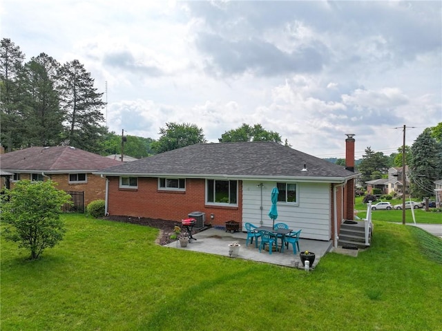 1199 Clover Circle Ct, Baldwin Boro, PA 15227 - rear view of house featuring a yard, a patio area, a chimney, and brick siding