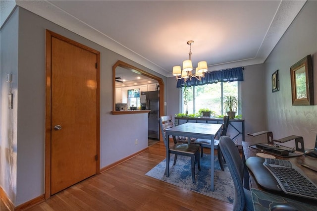 1199 Clover Circle Ct, Baldwin Boro, PA 15227 - dining space with a chandelier, wood finished floors, and crown molding