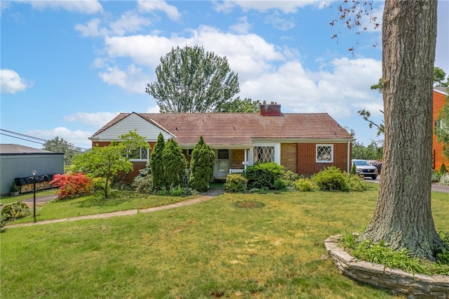 1228 Pinewood Dr, Mt Lebanon, PA 15243 - single story home featuring a front yard, a chimney, and brick siding