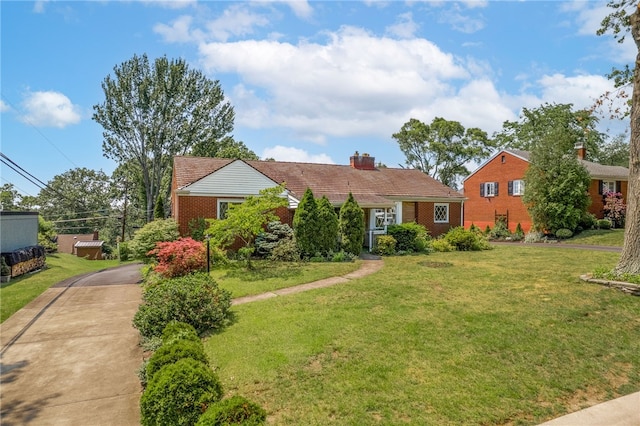 1228 Pinewood Dr, Mt Lebanon, PA 15243 - view of front of house featuring a front yard, a chimney, and concrete driveway