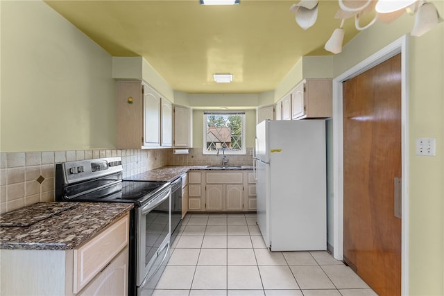 1228 Pinewood Dr, Mt Lebanon, PA 15243 - kitchen featuring freestanding refrigerator, stainless steel electric range, tasteful backsplash, and light tile patterned floors
