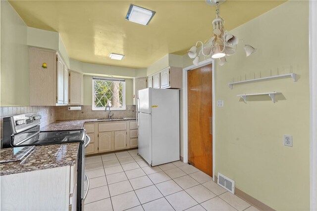 1228 Pinewood Dr, Mt Lebanon, PA 15243 - kitchen with freestanding refrigerator, electric stove, tasteful backsplash, light tile patterned flooring, and dark countertops