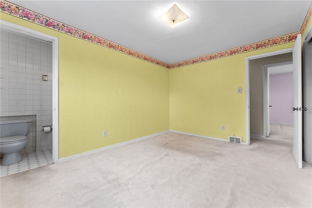 1228 Pinewood Dr, Mt Lebanon, PA 15243 - carpeted empty room featuring baseboards and tile walls