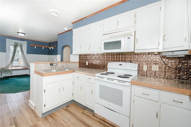 669 Franklin St, Cherryhll Twp/Clymer, PA 15728 - kitchen with white appliances, white cabinetry, and backsplash