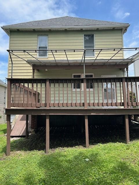 104 Whyle Ave, North Union Twp, PA 15401 - rear view of house featuring a wooden deck, a yard, and roof with shingles