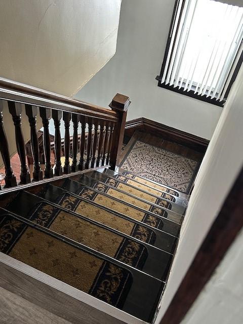 104 Whyle Ave, North Union Twp, PA 15401 - staircase featuring baseboards and wood finished floors