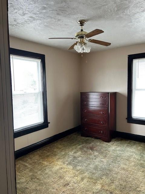 104 Whyle Ave, North Union Twp, PA 15401 - unfurnished bedroom featuring carpet flooring, a textured ceiling, and ceiling fan