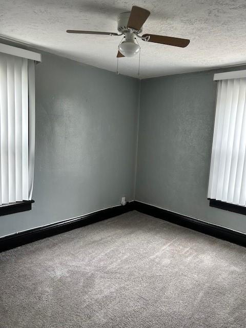 104 Whyle Ave, North Union Twp, PA 15401 - spare room featuring a ceiling fan, carpet floors, and a textured ceiling