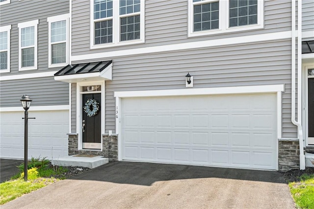 136 Sweetwater Dr, Moon/Crescent Twp, PA 15108 - garage with asphalt driveway