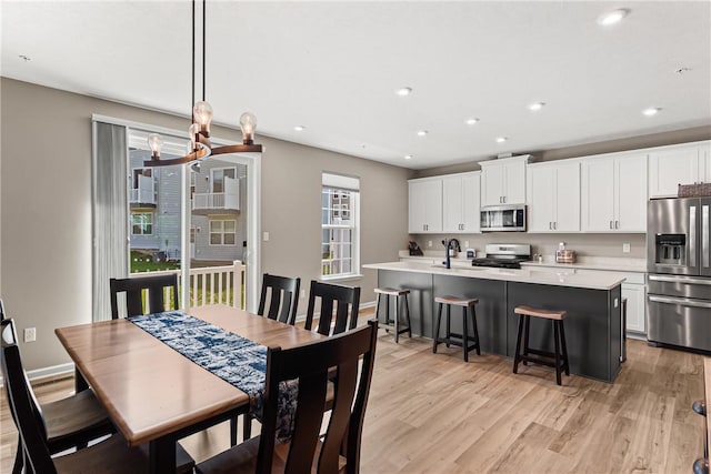 136 Sweetwater Dr, Moon/Crescent Twp, PA 15108 - dining area featuring light wood-type flooring and recessed lighting