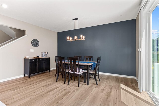136 Sweetwater Dr, Moon/Crescent Twp, PA 15108 - dining area with a chandelier and light wood-style flooring