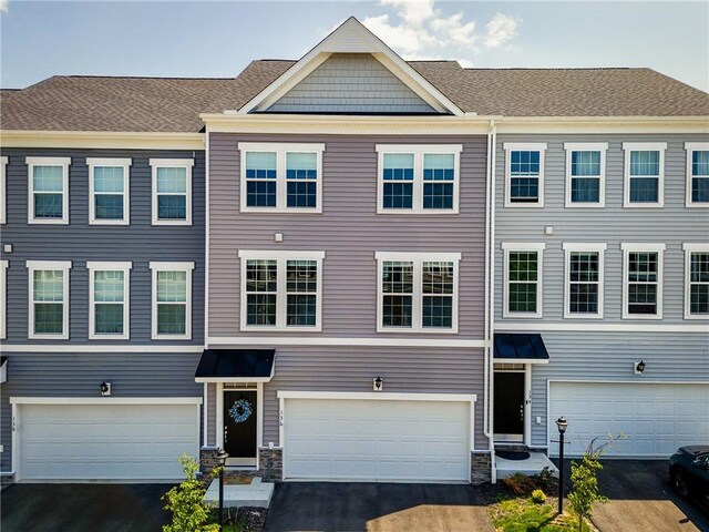 136 Sweetwater Dr, Moon/Crescent Twp, PA 15108 - multi unit property with asphalt driveway and a garage