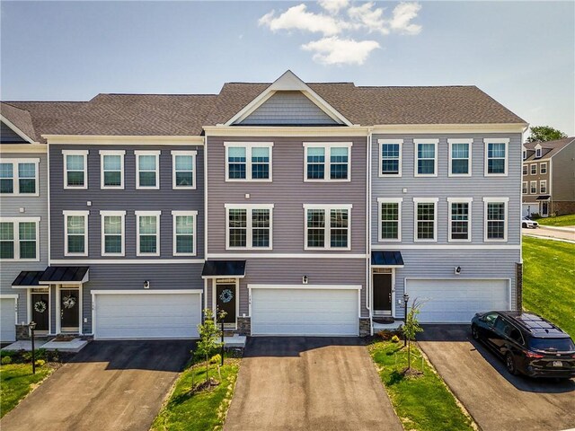 136 Sweetwater Dr, Moon/Crescent Twp, PA 15108 - townhome / multi-family property with an attached garage and driveway