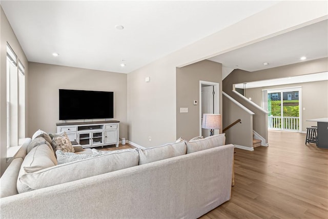 136 Sweetwater Dr, Moon/Crescent Twp, PA 15108 - living area featuring wood finished floors, stairway, and recessed lighting