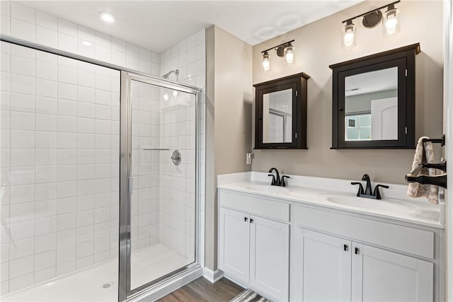 136 Sweetwater Dr, Moon/Crescent Twp, PA 15108 - full bathroom featuring double vanity, a stall shower, and wood finished floors