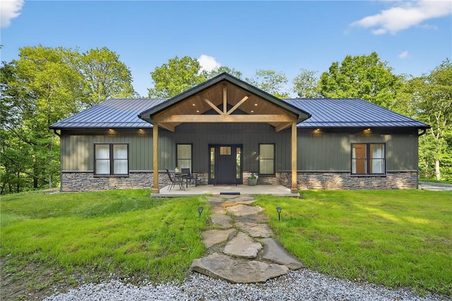 521 Creek Rd, Smith, PA 15019 - rear view of property with a standing seam roof, a metal roof, stone siding, and a yard