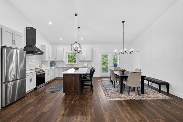 521 Creek Rd, Smith, PA 15019 - kitchen with appliances with stainless steel finishes, ventilation hood, a chandelier, light countertops, and french doors