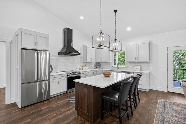 521 Creek Rd, Smith, PA 15019 - kitchen with appliances with stainless steel finishes, wall chimney range hood, light countertops, tasteful backsplash, and recessed lighting