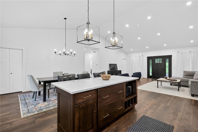 521 Creek Rd, Smith, PA 15019 - kitchen with a chandelier, open floor plan, light countertops, dark brown cabinetry, and pendant lighting