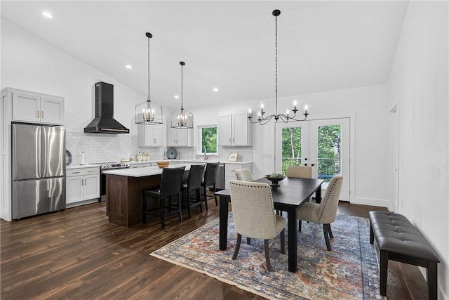 521 Creek Rd, Smith, PA 15019 - dining area with a chandelier, dark wood-type flooring, vaulted ceiling, french doors, and recessed lighting