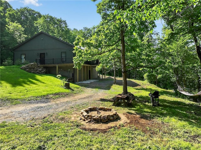 521 Creek Rd, Smith, PA 15019 - view of grassy yard with a fire pit, driveway, and a wooden deck