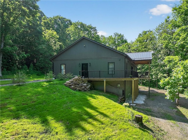 521 Creek Rd, Smith, PA 15019 - rear view of house with a yard, a wooden deck, and a metal roof