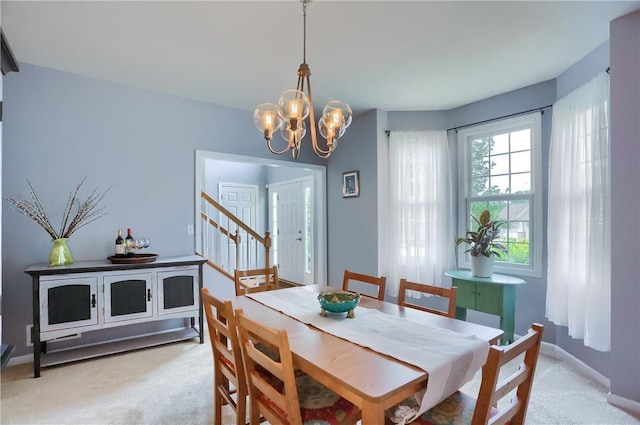 490 Tara Ct, Clinton Twp, PA 16056 - dining space featuring carpet flooring, a chandelier, and stairs