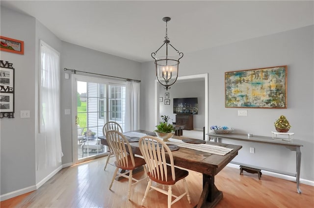 490 Tara Ct, Clinton Twp, PA 16056 - dining space with a chandelier and light wood-style floors