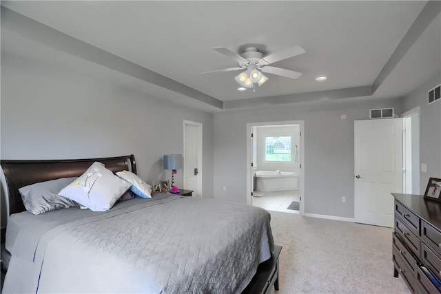 490 Tara Ct, Clinton Twp, PA 16056 - bedroom with a tray ceiling, light colored carpet, connected bathroom, ceiling fan, and recessed lighting
