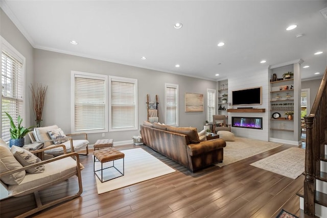 403 Cayuga Cir, Marshall, PA 16046 - living room with ornamental molding, wood finished floors, plenty of natural light, a glass covered fireplace, and recessed lighting
