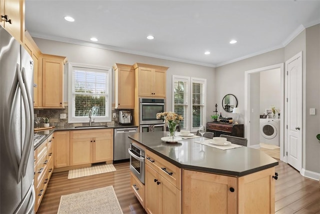 403 Cayuga Cir, Marshall, PA 16046 - kitchen with light brown cabinetry, stainless steel appliances, washer / clothes dryer, dark wood-type flooring, and dark countertops