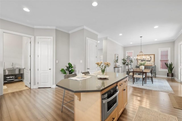 403 Cayuga Cir, Marshall, PA 16046 - kitchen with a kitchen bar, a center island, light wood-style floors, recessed lighting, and oven