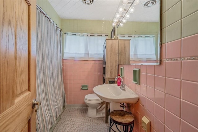 360 Jo Ann Dr, Monessen, PA 15062 - full bathroom with tile patterned flooring, a shower with curtain, and tile walls
