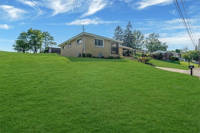 360 Jo Ann Dr, Monessen, PA 15062 - view of side of home featuring a lawn and brick siding