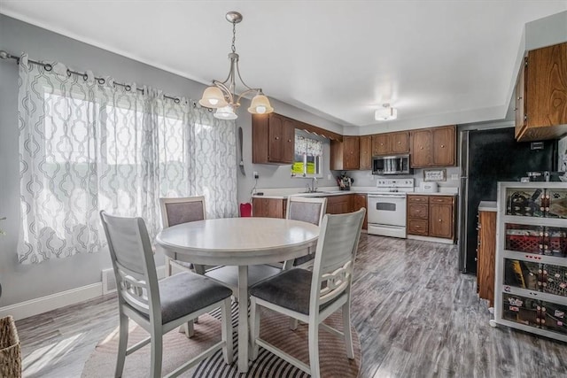360 Jo Ann Dr, Monessen, PA 15062 - dining area with light wood finished floors and a chandelier