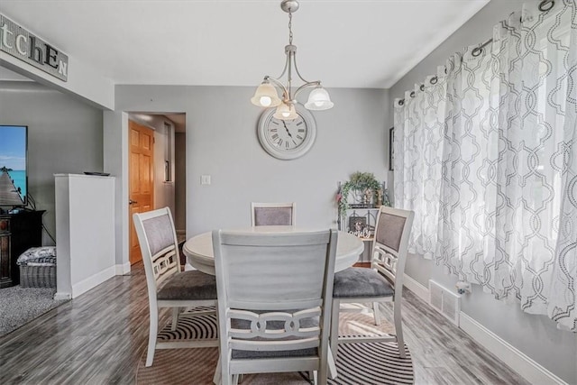 360 Jo Ann Dr, Monessen, PA 15062 - dining room with wood finished floors and a chandelier