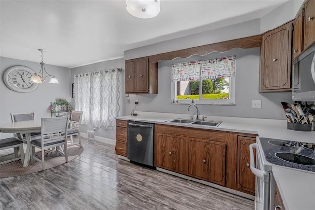 360 Jo Ann Dr, Monessen, PA 15062 - kitchen with dishwasher, electric stove, healthy amount of natural light, and light countertops