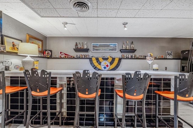 360 Jo Ann Dr, Monessen, PA 15062 - indoor dry bar with black fridge with ice dispenser