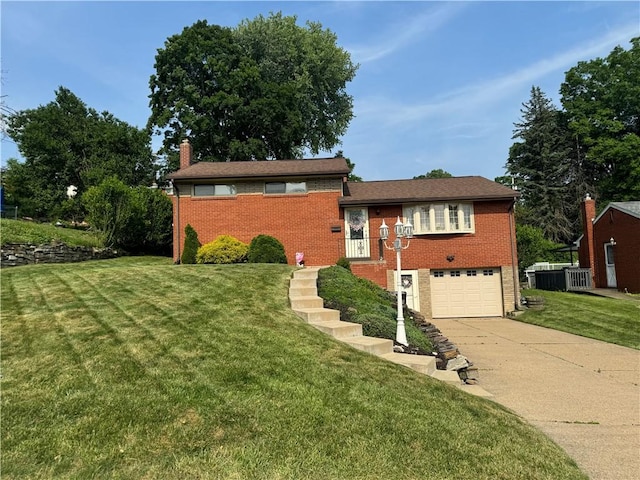 5301 Ranchview Dr, Baldwin Boro, PA 15236 - tri-level home with concrete driveway, brick siding, a garage, a chimney, and a front lawn