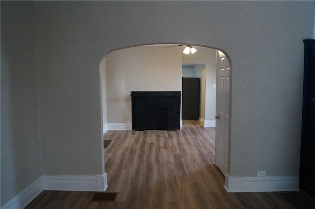 9 E Gaskill Ave, Jeannette, PA 15644 - corridor with arched walkways and wood finished floors