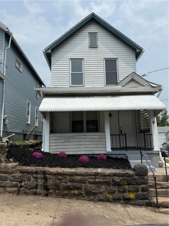 9 E Gaskill Ave, Jeannette, PA 15644 - view of front of house with covered porch