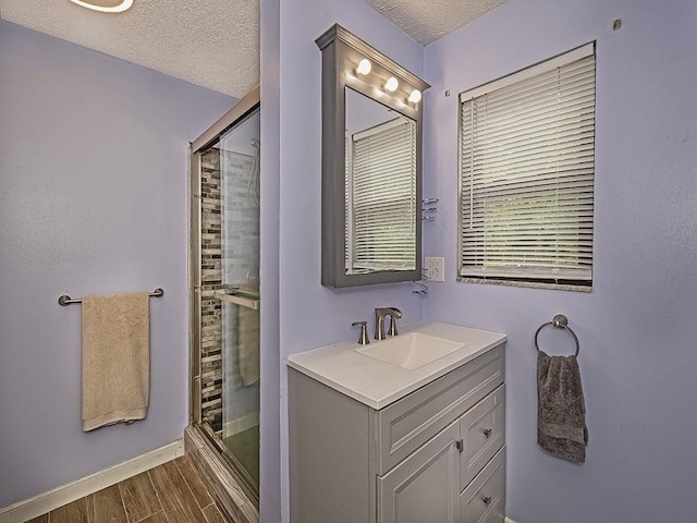 165 Monks Rd, Clinton Twp, PA 16056 - bathroom with a stall shower, vanity, wood finished floors, and a textured ceiling
