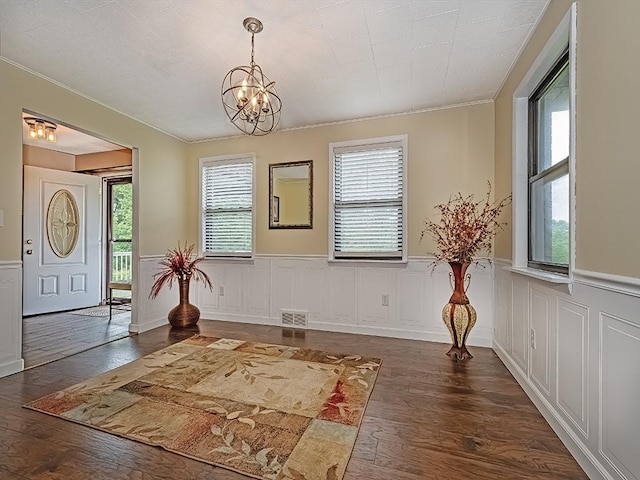 165 Monks Rd, Clinton Twp, PA 16056 - foyer entrance with crown molding, hardwood / wood-style floors, a chandelier, wainscoting, and a decorative wall