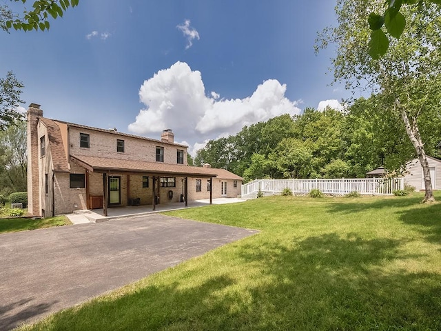 165 Monks Rd, Clinton Twp, PA 16056 - rear view of house featuring a chimney, a patio, and brick siding