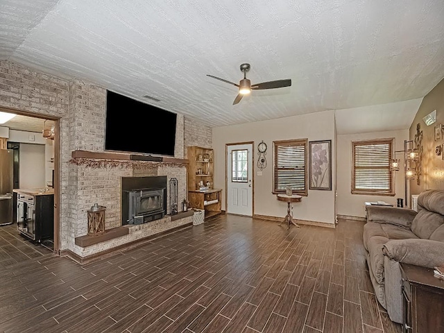 165 Monks Rd, Clinton Twp, PA 16056 - unfurnished living room with a ceiling fan, dark wood-type flooring, and a fireplace