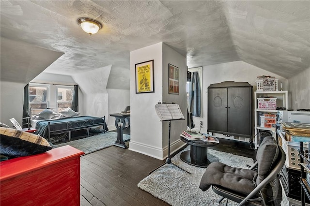 322 Darsie St, Bloomfield, PA 15224 - bedroom with lofted ceiling, wood-type flooring, and a textured ceiling