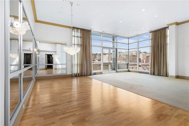 537 N Neville St Unit 6A, Shadyside, PA 15213 - unfurnished living room featuring a chandelier, floor to ceiling windows, crown molding, wood finished floors, and recessed lighting