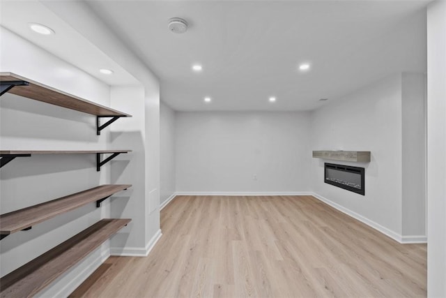 4736 Doyle Rd, Whitehall, PA 15227 - below grade area with recessed lighting, wood finished floors, and a glass covered fireplace