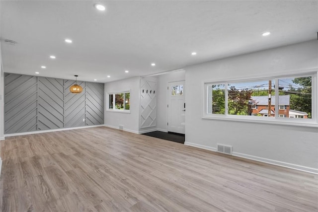 4736 Doyle Rd, Whitehall, PA 15227 - unfurnished living room featuring recessed lighting and wood finished floors