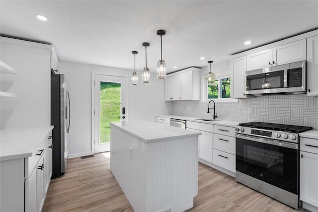4736 Doyle Rd, Whitehall, PA 15227 - kitchen with stainless steel appliances, healthy amount of natural light, a kitchen island, decorative backsplash, and recessed lighting